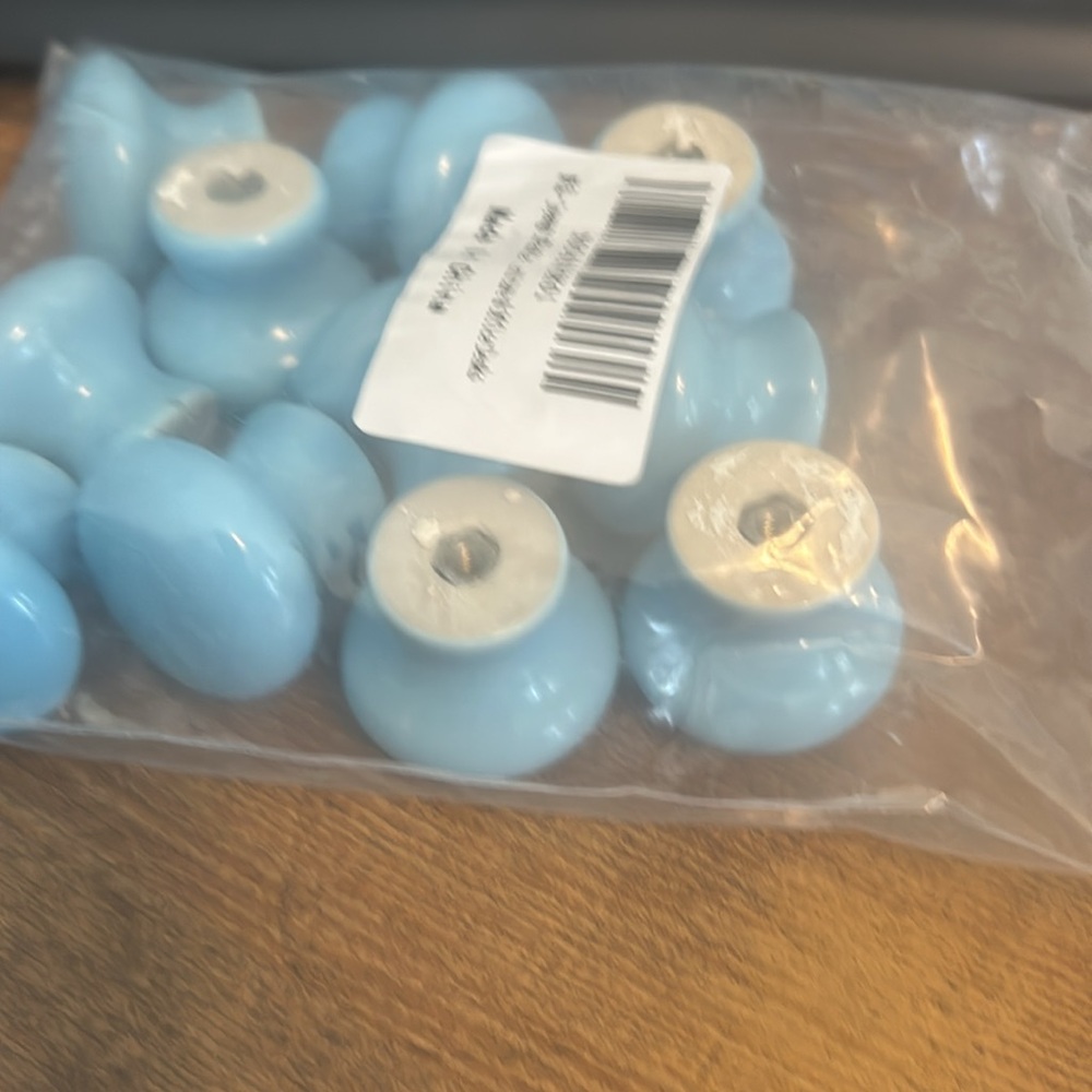 Set of 13. Used blue drawer pulls
